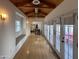 Open hallway with hardwood floors, a wooden ceiling, and a bench seat under the window at 1301 E Sheridan St, Phoenix, AZ 85006