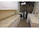 Laundry room with modern appliances, granite countertops, and ample storage space at 1301 E Sheridan St, Phoenix, AZ 85006