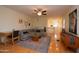 Open-concept living room with hardwood floors, neutral walls, and a comfortable sectional sofa at 1301 E Sheridan St, Phoenix, AZ 85006