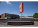 Exterior shot of Sunshine Market with ample parking, vibrant signage, and a 'Coronado Historic Neighborhood' marker in front at 1301 E Sheridan St, Phoenix, AZ 85006