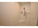 Modern tiled shower with built-in bench and niche for toiletries, providing a spa-like experience at 1301 E Sheridan St, Phoenix, AZ 85006