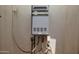 Close-up view of the Rheem EcoSense tankless water heater system installed on the exterior wall at 1301 E Sheridan St, Phoenix, AZ 85006