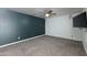 Comfortable bedroom featuring a contemporary accent wall and plush carpeting at 1360 E Brown Rd # 9, Mesa, AZ 85203