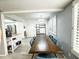 Dining room with wood-look tile floors and a view into the kitchen at 1360 E Brown Rd # 9, Mesa, AZ 85203