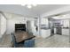 Bright kitchen adjacent to the dining area, featuring white cabinets and modern stainless steel appliances at 1360 E Brown Rd # 9, Mesa, AZ 85203