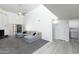 Spacious living room filled with natural light and neutral tones, seamlessly connected to the laundry area at 1360 E Brown Rd # 9, Mesa, AZ 85203