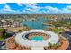 Aerial shot featuring the community's circular pool area, community lake and picturesque neighborhood at 13640 N Del Webb Blvd, Sun City, AZ 85351