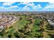 Scenic aerial view of the golf course featuring lush green fairways, mature trees and beautifully manicured greens at 13640 N Del Webb Blvd, Sun City, AZ 85351