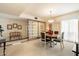 Well-lit dining area featuring a classic chandelier and dining room table set at 13640 N Del Webb Blvd, Sun City, AZ 85351