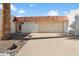 Charming single-story home showcasing a red tile roof and attached two-car garage at 13640 N Del Webb Blvd, Sun City, AZ 85351