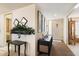 Inviting foyer with decor, mirrors, and a view of the home's entrance at 13640 N Del Webb Blvd, Sun City, AZ 85351