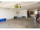 Spacious garage with ample storage space, work area, and secure access to the home at 13640 N Del Webb Blvd, Sun City, AZ 85351