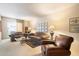 Comfortable living room with neutral carpet, soft lighting, and comfortable seating at 13640 N Del Webb Blvd, Sun City, AZ 85351