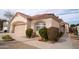 Charming single-story home with a two-car garage and mature landscaping at 14130 W Bent Tree Cir, Litchfield Park, AZ 85340