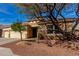 Single-story home with desert landscaping, neutral color palette, and a three-car garage at 15062 W Windward Ave, Goodyear, AZ 85395