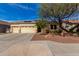 Charming single-story home featuring desert landscaping, three-car garage, and neutral color palette at 15062 W Windward Ave, Goodyear, AZ 85395