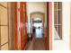 Inviting foyer showcasing hardwood floors and a glimpse into the open-concept living space at 15062 W Windward Ave, Goodyear, AZ 85395