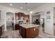 Gourmet kitchen featuring a large island, stainless steel appliances, and ample storage at 15062 W Windward Ave, Goodyear, AZ 85395