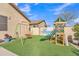 Fun backyard play area with artificial turf, swing set, and slide for  at 16847 W Marconi Ave, Surprise, AZ 85388
