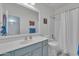 Bathroom featuring vanity with storage and shower tub combination at 16847 W Marconi Ave, Surprise, AZ 85388