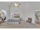 Bedroom featuring a comfortable bed with modern furnishings, soft carpet, and a ceiling fan at 16847 W Marconi Ave, Surprise, AZ 85388