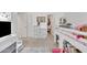 Bedroom with cozy reading space under a bunk bed and shelving at 16847 W Marconi Ave, Surprise, AZ 85388