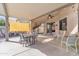 This large, covered patio features a dining area and lounge space, perfect for enjoying outdoor living at 16847 W Marconi Ave, Surprise, AZ 85388
