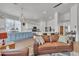 Open-concept living space with a kitchen view, tile floors, and comfortable seating at 16847 W Marconi Ave, Surprise, AZ 85388