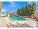 A refreshing pool offers a serene escape, surrounded by lush greenery and ample space for relaxation and recreation at 16847 W Marconi Ave, Surprise, AZ 85388
