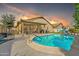 Inviting backyard pool and patio area, perfect for outdoor entertaining with sunset colors at 16847 W Marconi Ave, Surprise, AZ 85388