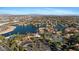 Panoramic aerial view showing the lakefront homes, tennis courts and city landscape at 1700 E Lakeside Dr # 16, Gilbert, AZ 85234