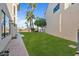 Grassy backyard with lush landscaping, and views of the lake, creating a private outdoor retreat at 1700 E Lakeside Dr # 16, Gilbert, AZ 85234