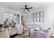 Bright bedroom with mirrored closet, fan, and desk area with white modern furniture at 1700 E Lakeside Dr # 16, Gilbert, AZ 85234