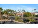 Beautiful clubhouse featuring tile roof, mature landscaping, palm trees, and ample parking at 1700 E Lakeside Dr # 16, Gilbert, AZ 85234