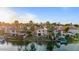 Waterfront home featuring lush landscaping, private docks, and serene views of the surrounding water at 1700 E Lakeside Dr # 16, Gilbert, AZ 85234
