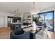 Open concept kitchen featuring granite countertops, an island with seating, and water views at 1700 E Lakeside Dr # 16, Gilbert, AZ 85234