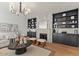 Inviting living room with fireplace, built-in shelves, and contemporary decor at 1700 E Lakeside Dr # 16, Gilbert, AZ 85234