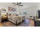 Serene main bedroom with neutral decor, ceiling fan and a large patterned rug at 1700 E Lakeside Dr # 16, Gilbert, AZ 85234