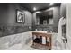 Stylish powder room featuring dark textured walls, marble accents, and modern fixtures at 1700 E Lakeside Dr # 16, Gilbert, AZ 85234