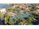 Aerial view of community tennis courts surrounded by palm trees and lush greenery at 1700 E Lakeside Dr # 16, Gilbert, AZ 85234