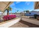 Charming fenced front patio with mature landscaping and a view of the neighborhood at 17405 N Conquistador Dr, Sun City West, AZ 85375