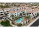 Beautiful aerial of condo community, showcasing the pool, clubhouse, lush landscaping, and well-maintained exteriors at 17773 N 77Th Way, Scottsdale, AZ 85255