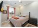 Bright bedroom with soft lighting, neutral walls, and a large window, complete with a comfortable bed and stylish decor at 17773 N 77Th Way, Scottsdale, AZ 85255