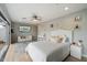 Comfortable bedroom featuring a cozy sitting area, ceiling fan, and neutral decor, creating a serene and inviting space at 17773 N 77Th Way, Scottsdale, AZ 85255