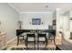 Stylish dining area with a glass table, adjacent to the kitchen, perfect for modern living at 17773 N 77Th Way, Scottsdale, AZ 85255