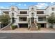 Stunning three-story townhome featuring a private garage, balconies and traditional architecture at 17773 N 77Th Way, Scottsdale, AZ 85255