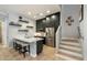 Modern kitchen features stainless steel appliances, light countertops, dark cabinetry and hardwood floors at 17773 N 77Th Way, Scottsdale, AZ 85255