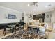 An open living space featuring modern decor and a seamless transition to the kitchen and dining areas at 17773 N 77Th Way, Scottsdale, AZ 85255