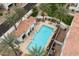 Aerial view of a community pool featuring a cabana, lounge chairs, and well-maintained landscaping creating a relaxing oasis at 17773 N 77Th Way, Scottsdale, AZ 85255