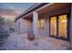 Covered back patio features flagstone and views of desert landscape at 18391 W Verdin Rd, Goodyear, AZ 85338